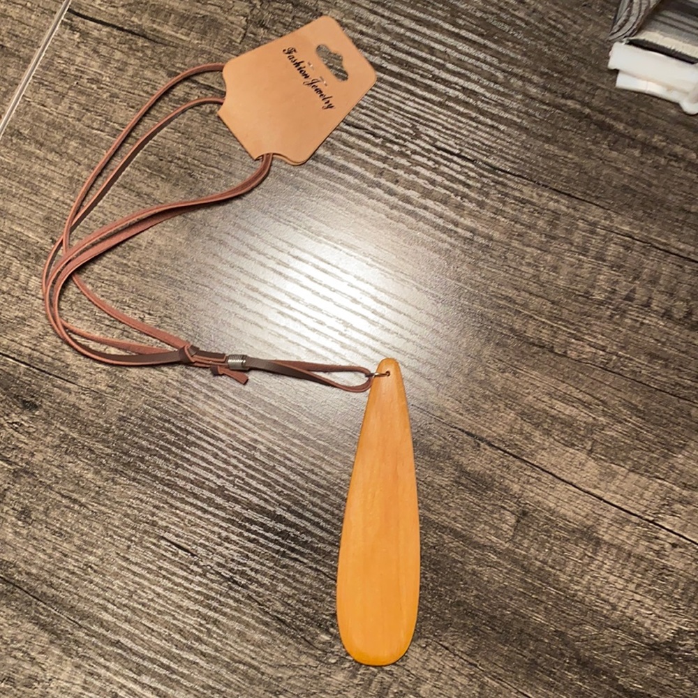 Tear drop pure wood charm dangling off a rope chain!